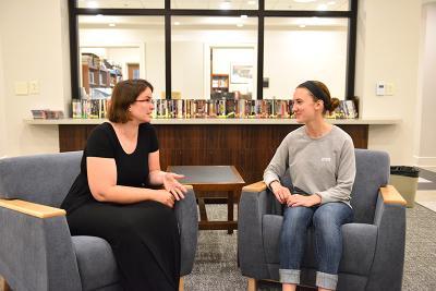 Dr. Vera Heuer and Allie Sassaman '22 discuss Sassaman's research on women in terrorism.—VMI Photo by Eric Moore.